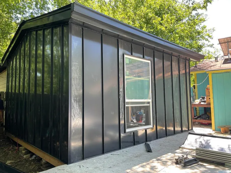 Black standing seam metal wall panels for Roof Inspection in Decorah