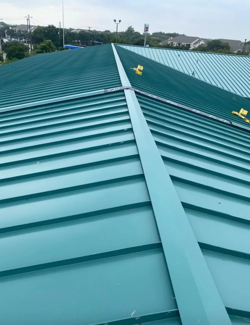 Green commercial metal roof ridge and valley for Metal Roof Repair in Decorah
