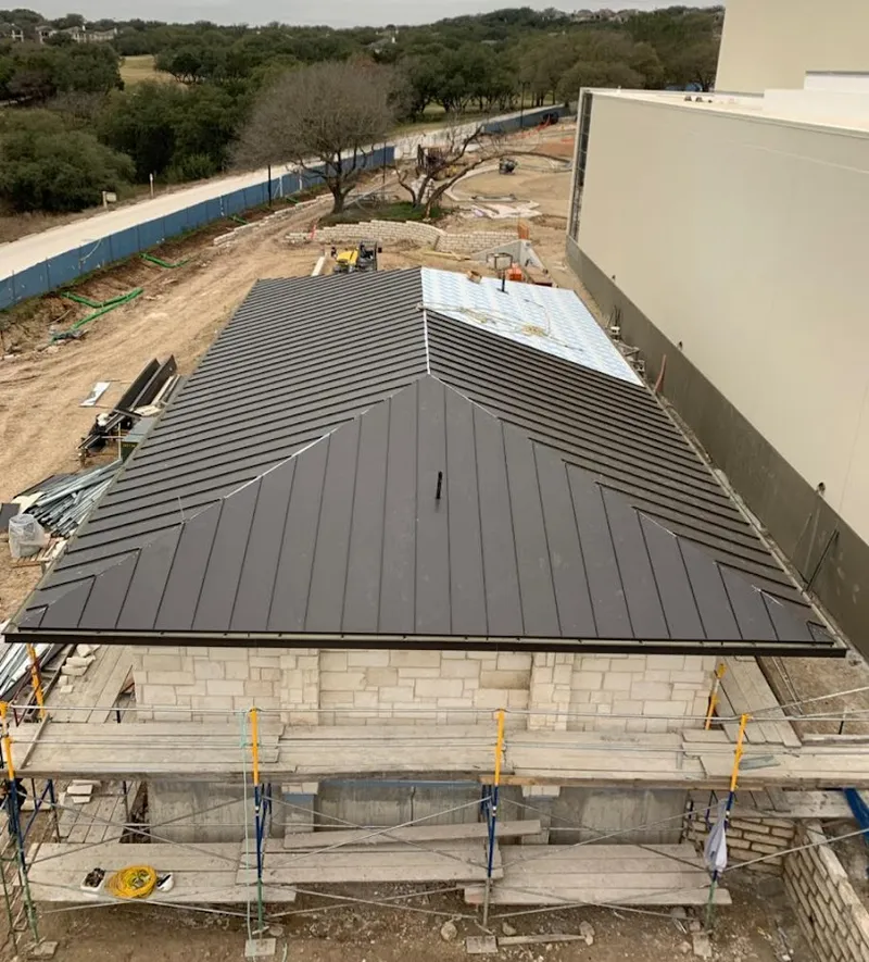 Metal roof new construction with scaffolding in Decorah